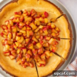 Apple cheesecake cut into slices.