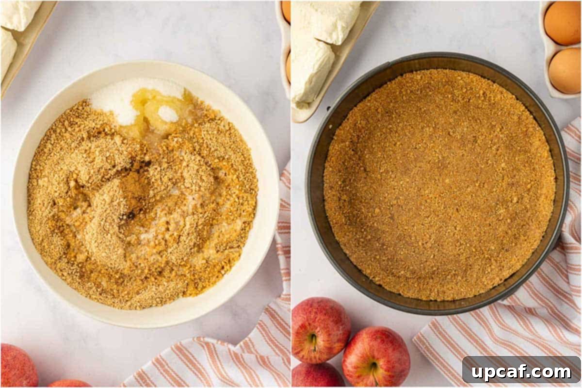 Hands pressing a graham cracker crumb mixture into the bottom of a springform pan to create a cheesecake crust.