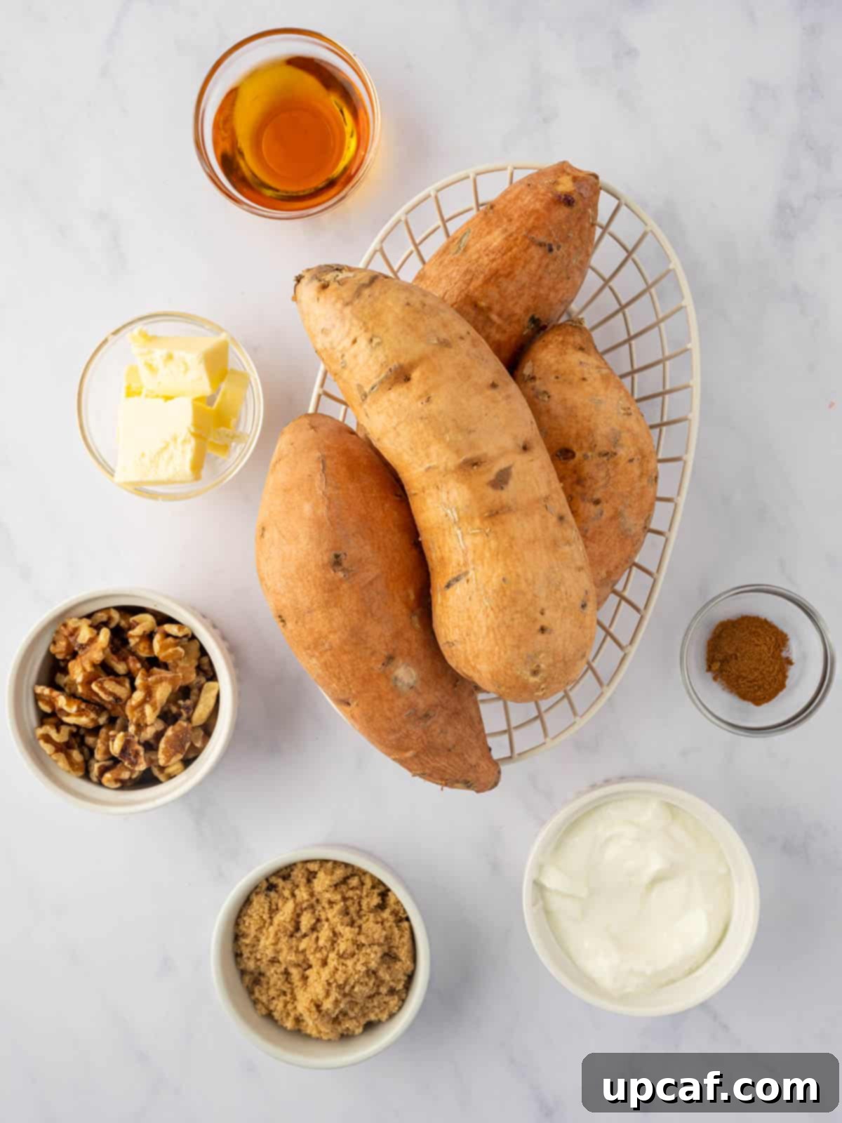 Maple Glazed Sweet Potatoes with Toasted Walnuts 3 Ingredients for maple walnut twice baked sweet potatoes, including whole sweet potatoes, brown sugar, maple syrup, and walnuts.