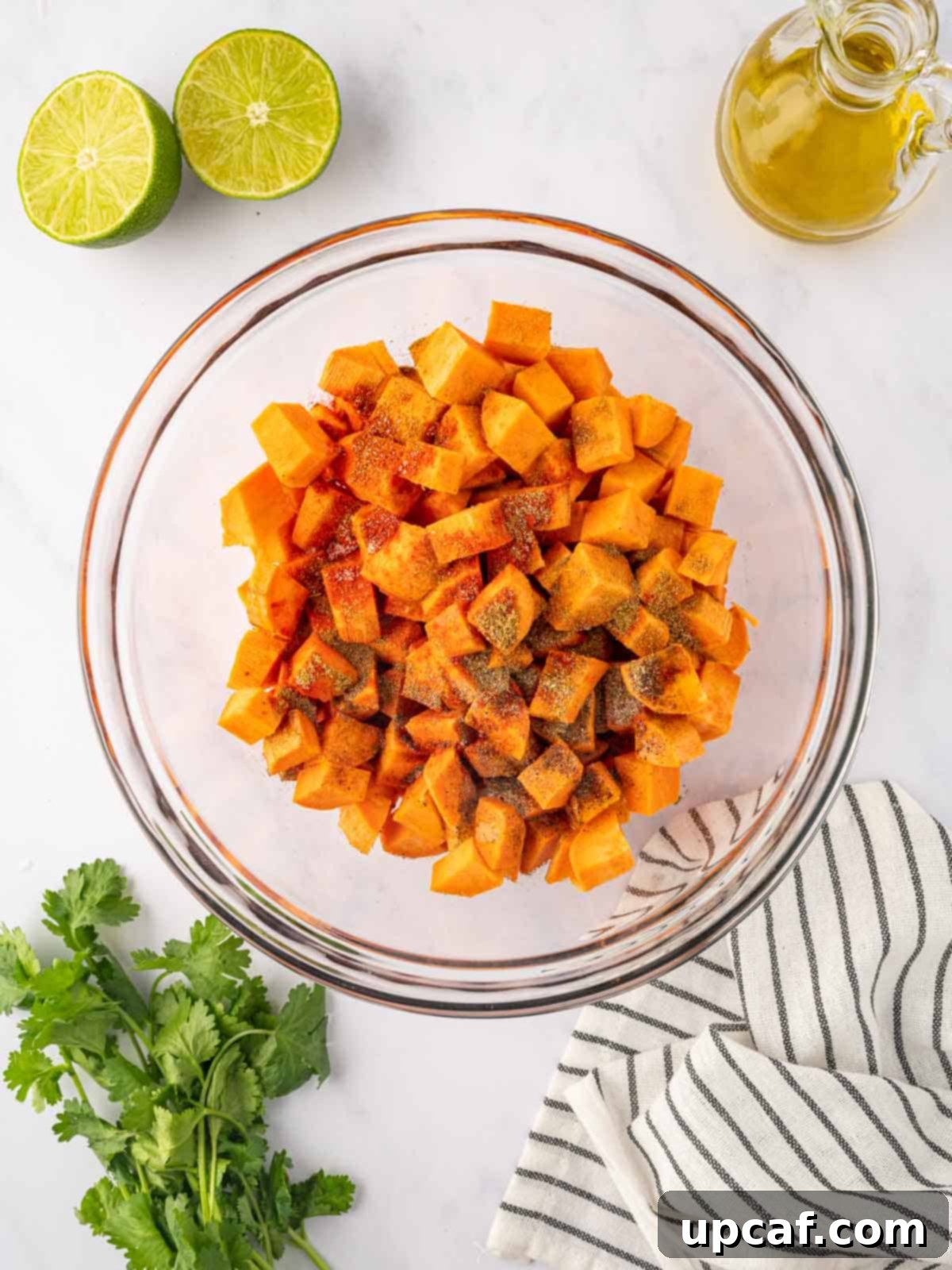 Roasted Sweet Potato Quinoa Salad 4 Seasoned sweet potato cubes in a bowl, ready for roasting.