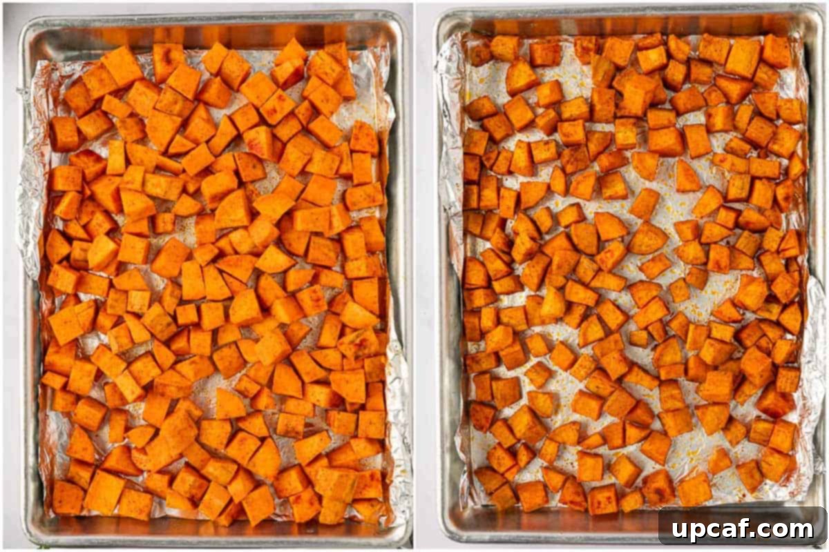 Roasted Sweet Potato Quinoa Salad 5 Seasoned sweet potatoes spread out on a parchment-lined baking tray, ready to be roasted.