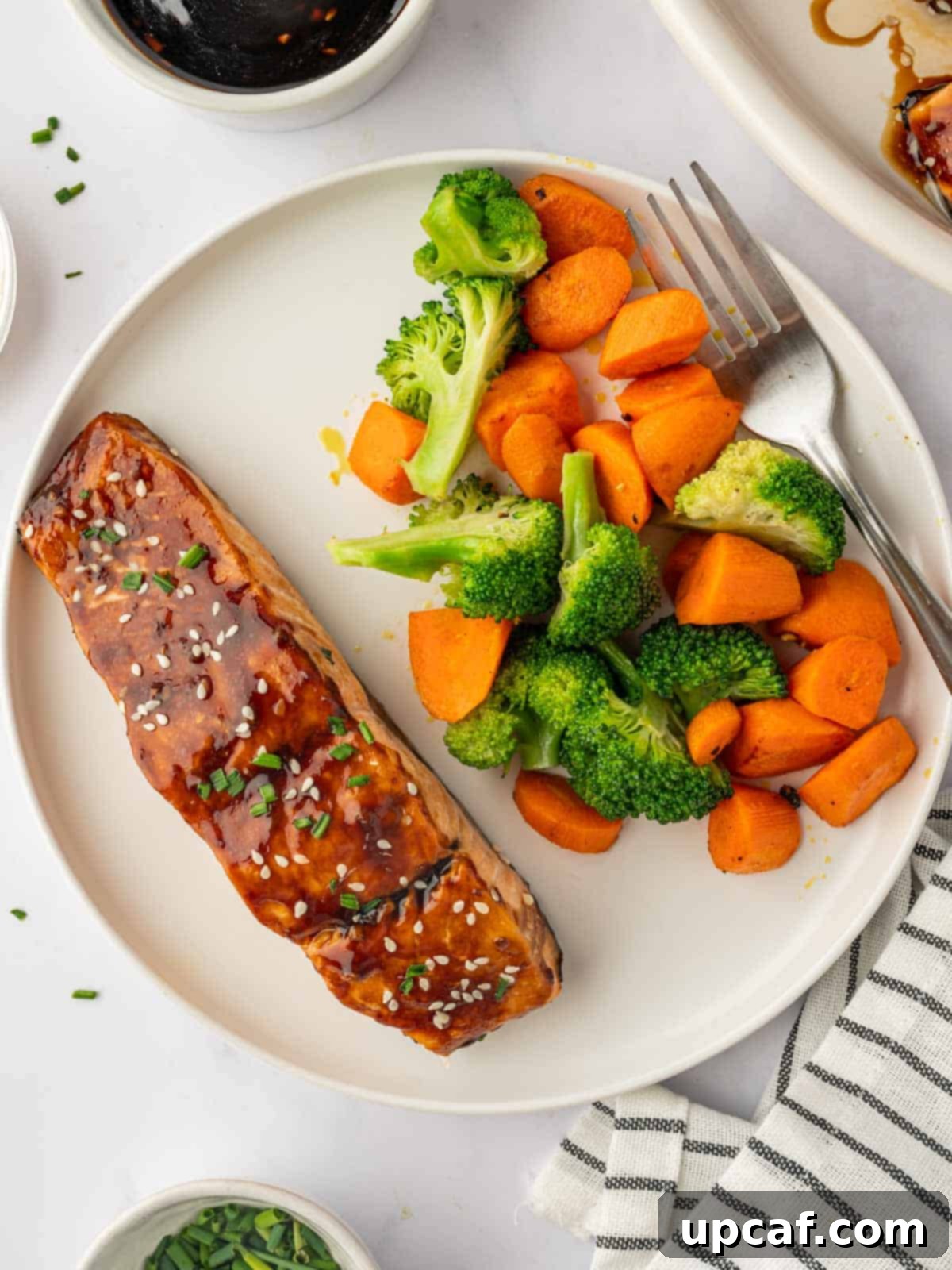 Salmon ready to serve with fresh vegetables.