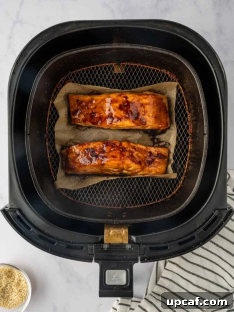 Crispy air fried salmon in an air fryer.