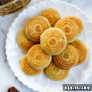 Date filled maamoul on a white plate.