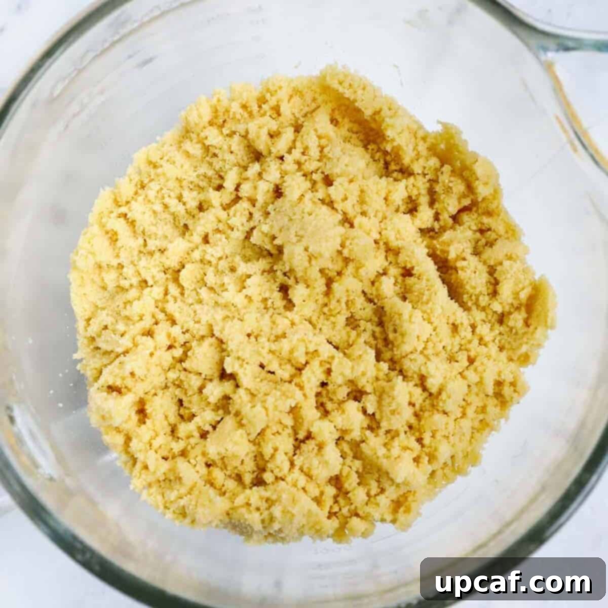 Semolina mixture for maamoul in a bowl after the overnight rest.