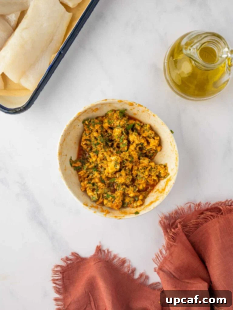 A bowl filled with the vibrant herb lime cod marinade, showcasing its rich texture and color.