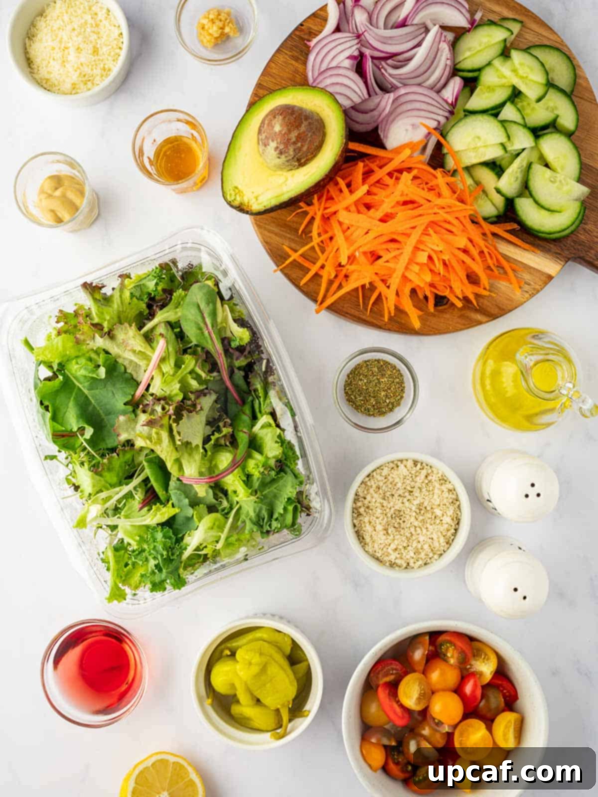 All the fresh ingredients meticulously laid out, ready to be assembled for a traditional house salad recipe.