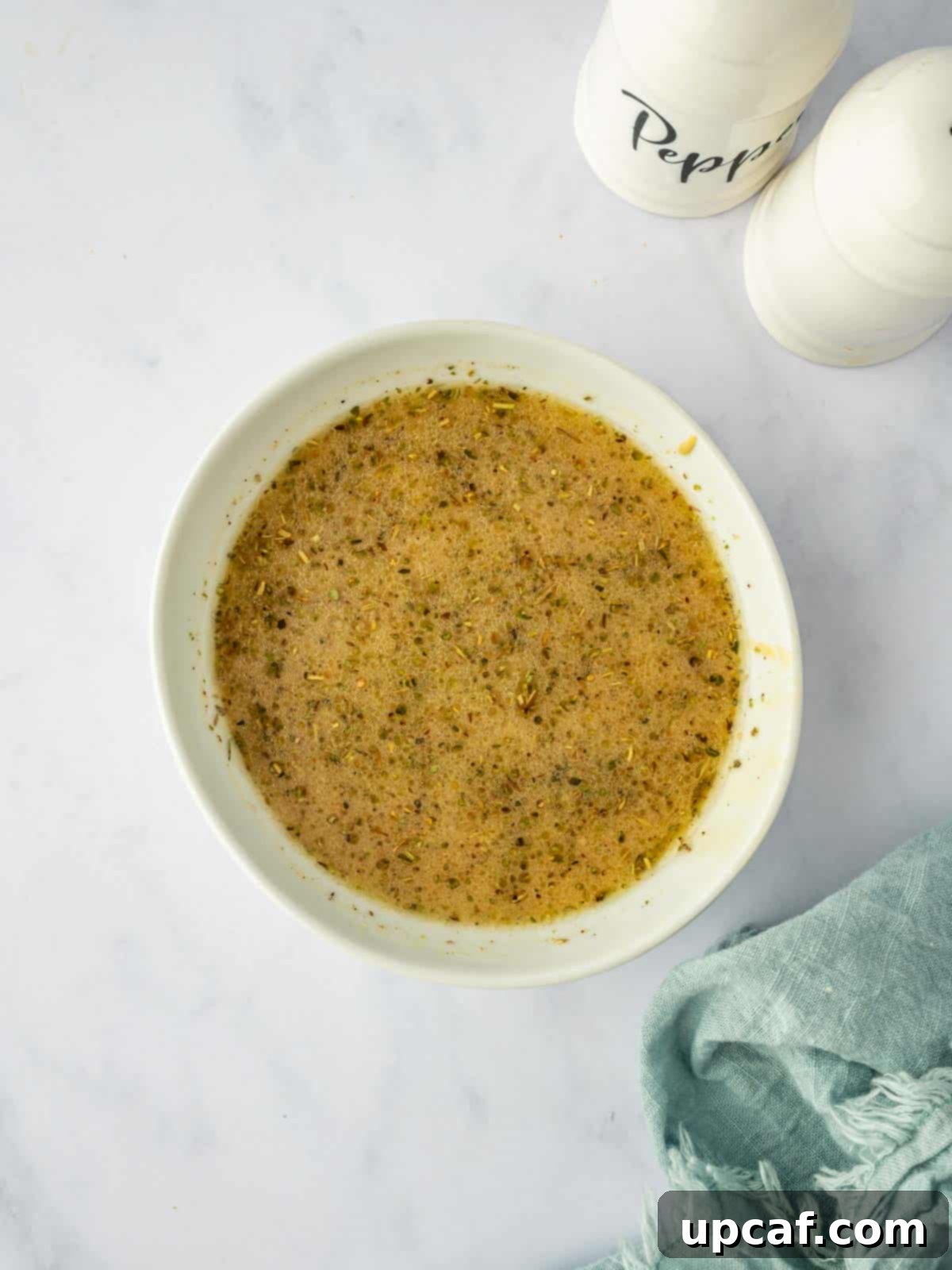 The finished homemade steakhouse salad vinaigrette, perfectly emulsified and ready to dress the salad.