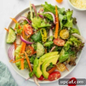 A single serving of the house salad presented beautifully on a plate, ready to be enjoyed.