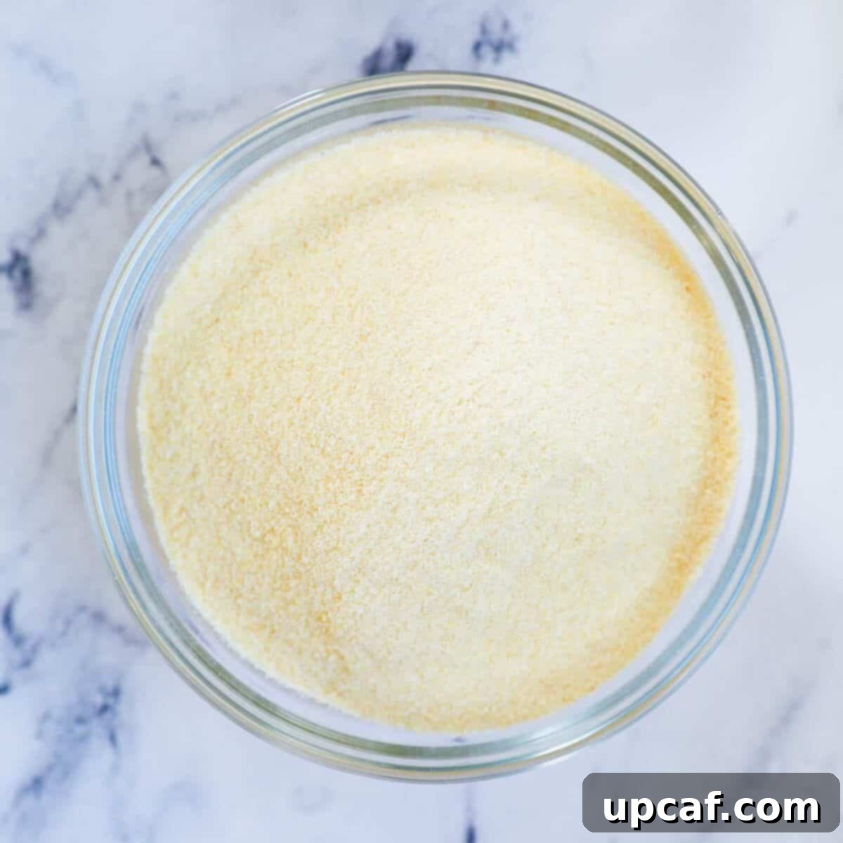 Close-up of fine semolina flour in a bowl, highlighting its smooth, powdery consistency.