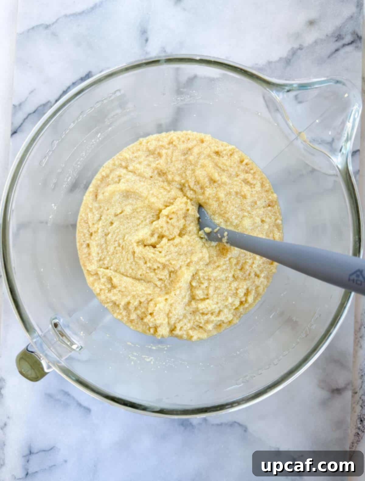 The fully mixed Namoura batter, smooth and consistent, in a large mixing bowl.