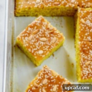 Pieces of Lebanese Turmeric Cake (Sfouf) in a baking tray.
