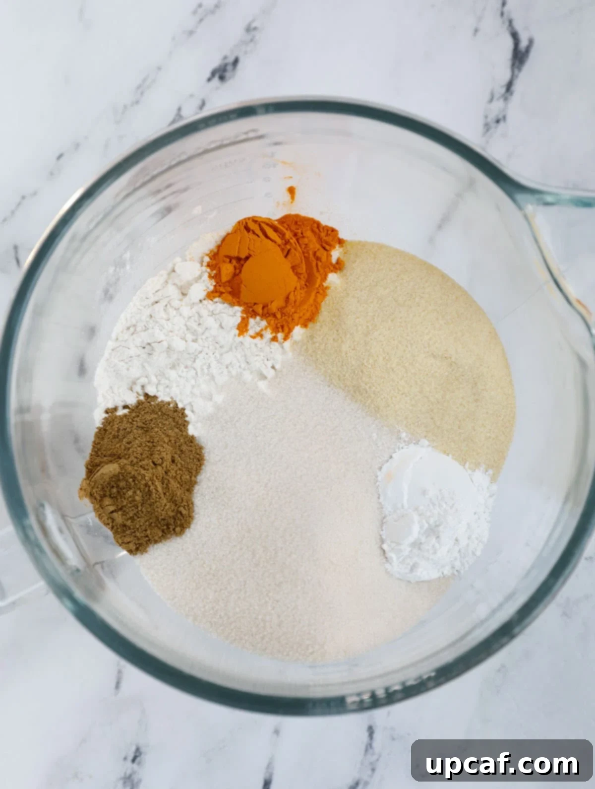 Dry ingredients of sfouf cake in a bowl.
