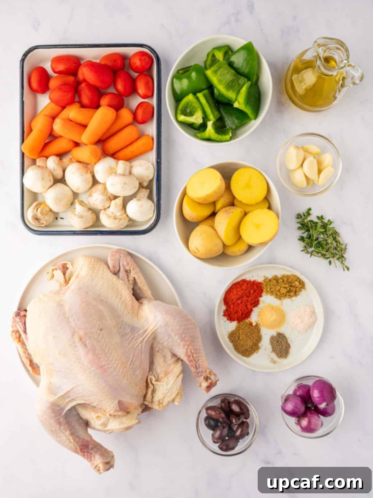 Ingredients needed for mediterranean roasted chicken arranged on a table.