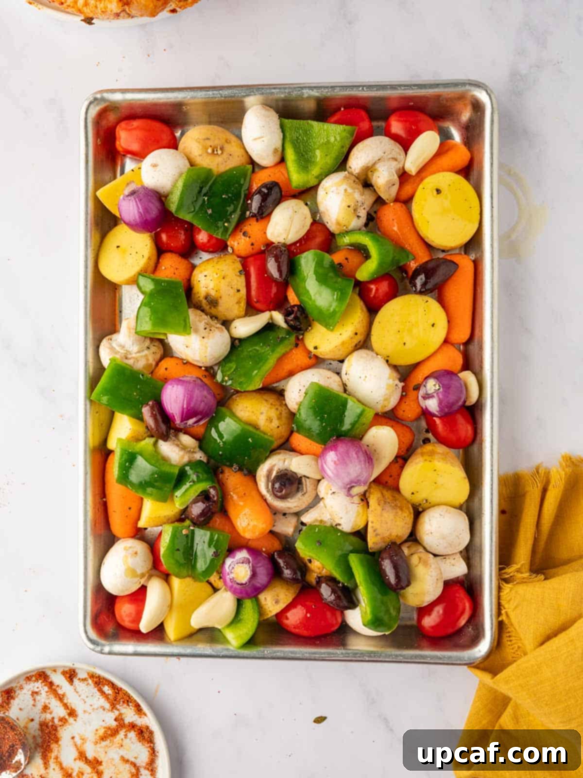 Assortment of colorful vegetables arranged on a sheet pan.