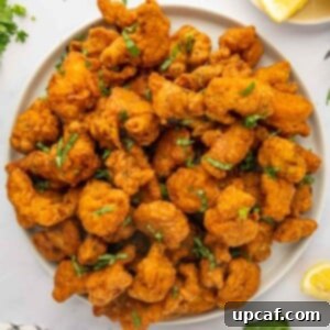 Golden Crispy Chicken Pakora 11 A large serving platter of chicken pakora.