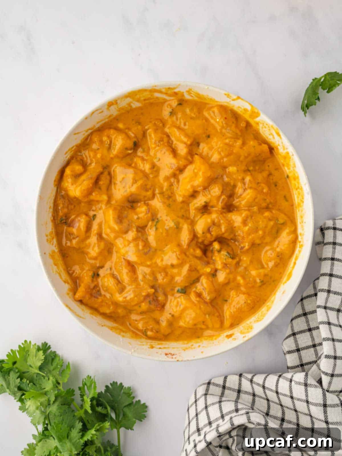 Golden Crispy Chicken Pakora 7 Close-up of chicken pieces fully coated in a thick, spiced gram flour batter, ready for frying.