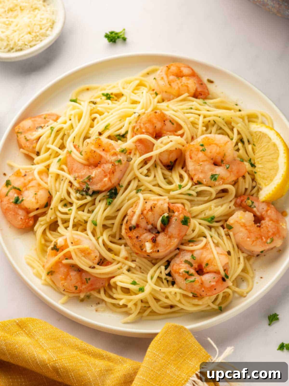 A platter of shrimp scampi pasta.