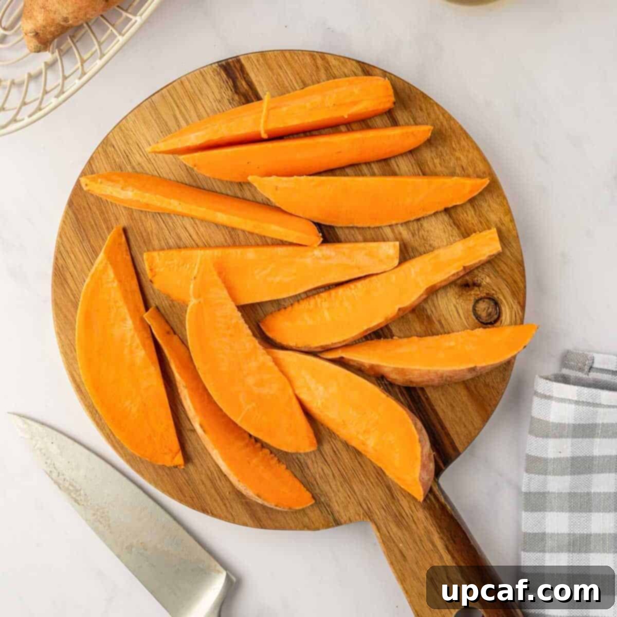 How to slice sweet potatoes into wedges.
