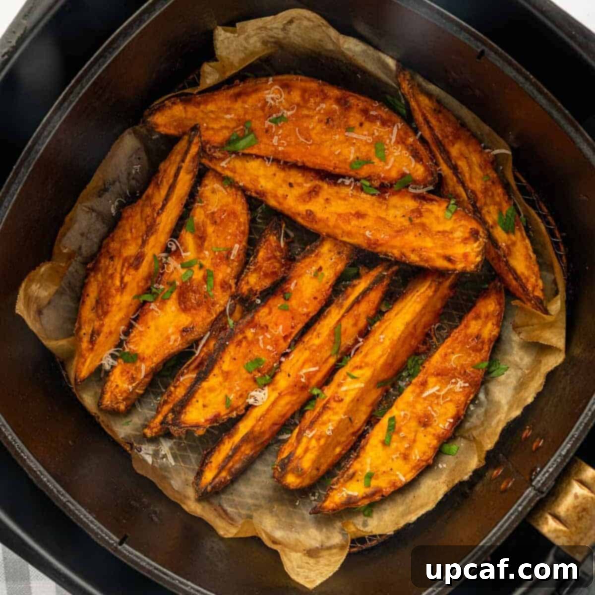 Air fried sweet potatoes in the basket.