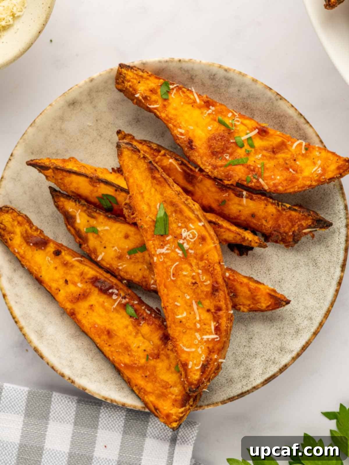 Several sweet potato wedges on a plate.