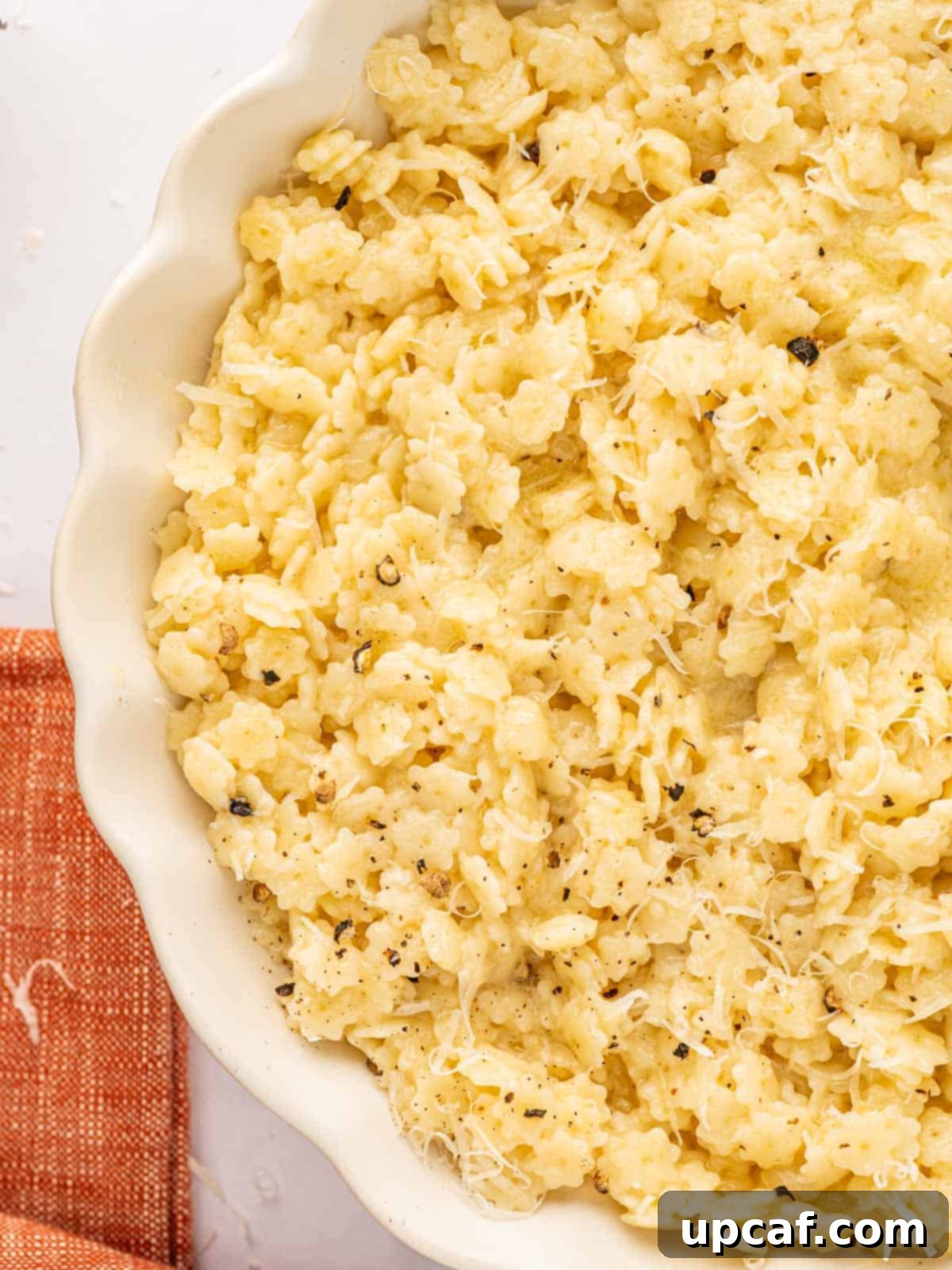 A close-up shot of dry stelline pasta in a bowl.