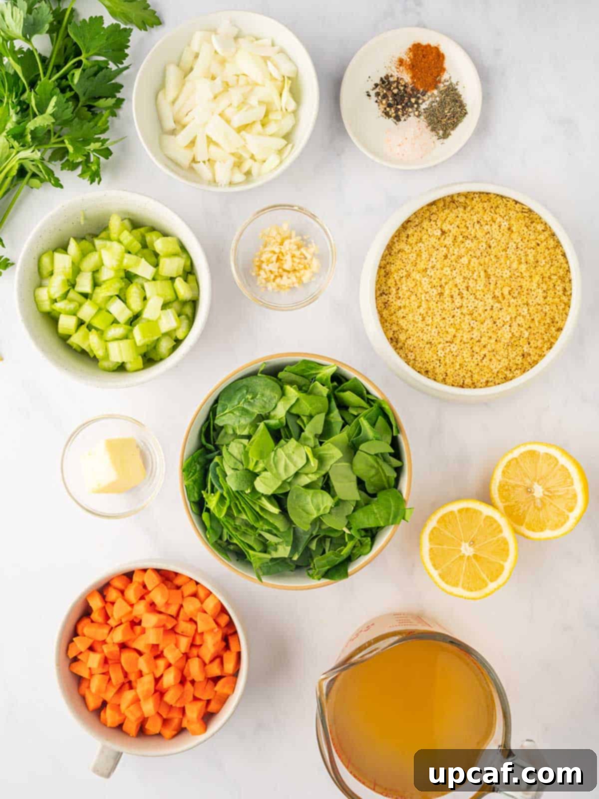 Comforting Italian Pastina Soup 3 A selection of fresh ingredients laid out for Pastina soup, including vegetables, herbs, and pasta.