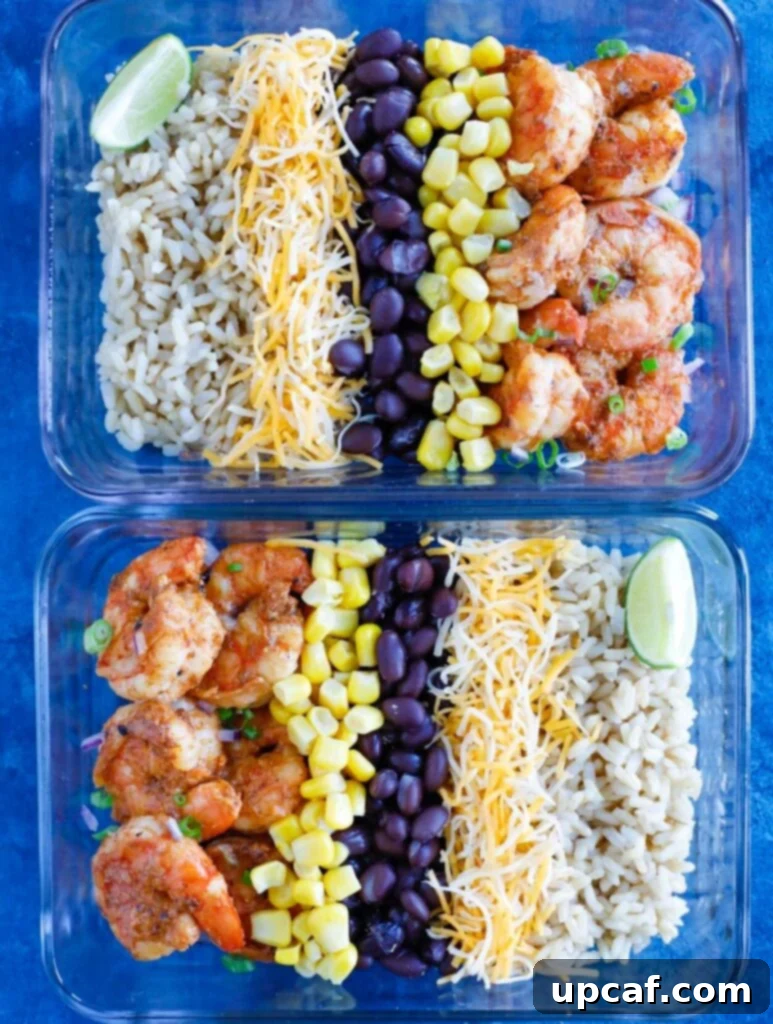 Shrimp Taco Meal Prep Delicious Shrimp Taco Meal Prep in a clear glass container, showcasing fresh ingredients like seasoned shrimp, black beans, corn, and rice.