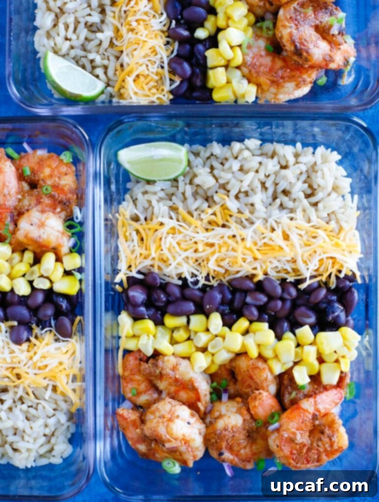 Shrimp Taco Meal Prep Overhead shot of three perfectly assembled Shrimp Taco Meal Prep bowls, ready for the week.