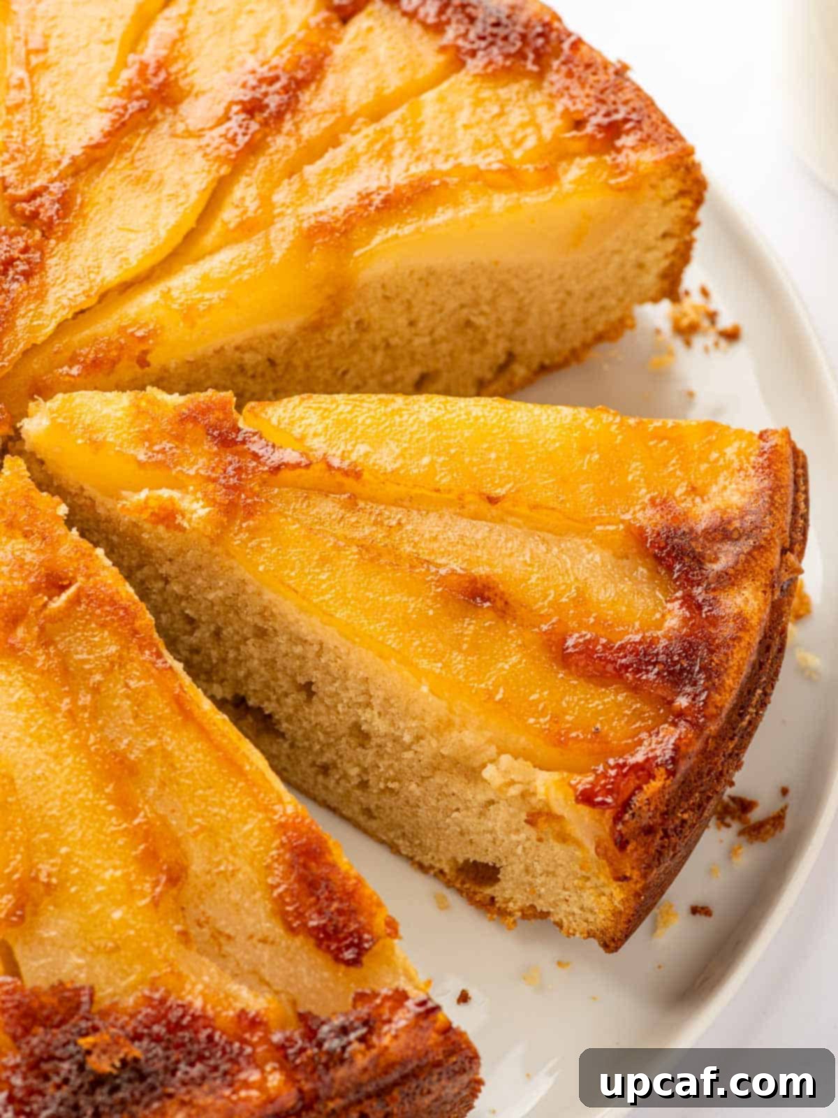 Caramelized Pear Crown Cake 2 Slices of upside down pear cake on a plate, showcasing caramelized pears.