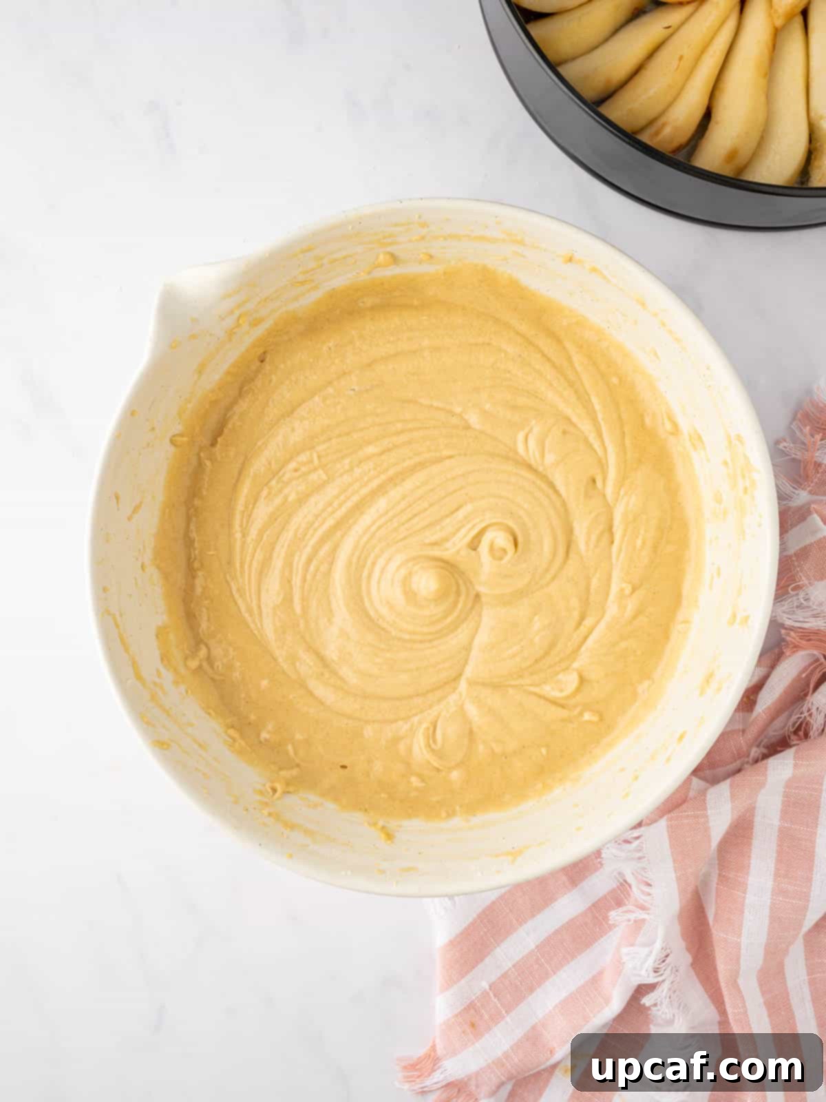 Caramelized Pear Crown Cake 12 Prepared cake batter in a bowl, smooth and ready to pour.