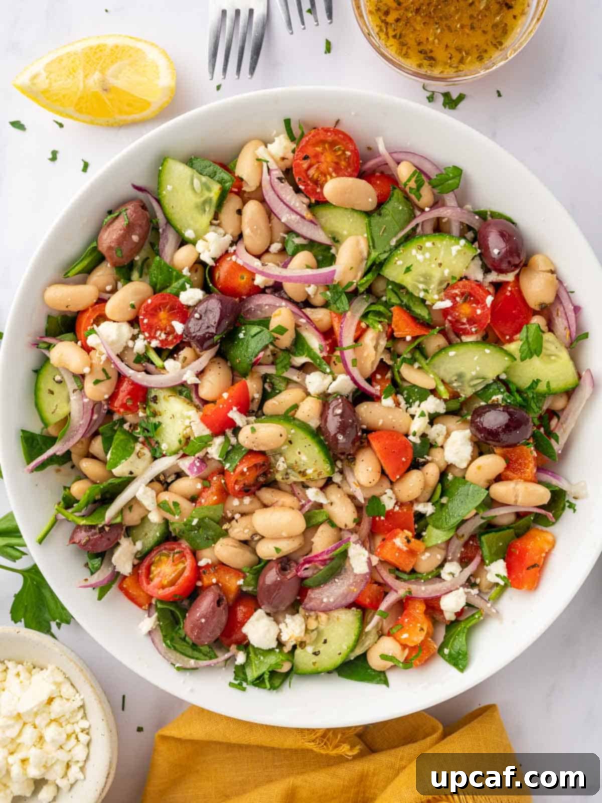 Fresh Greek White Bean Salad serving in a bowl.