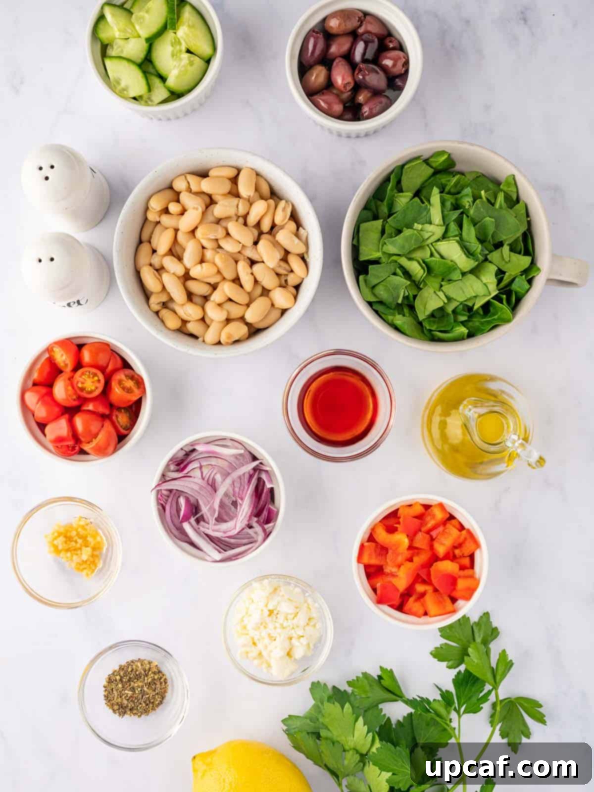Ingredients needed for Greek Bean salad laid out.