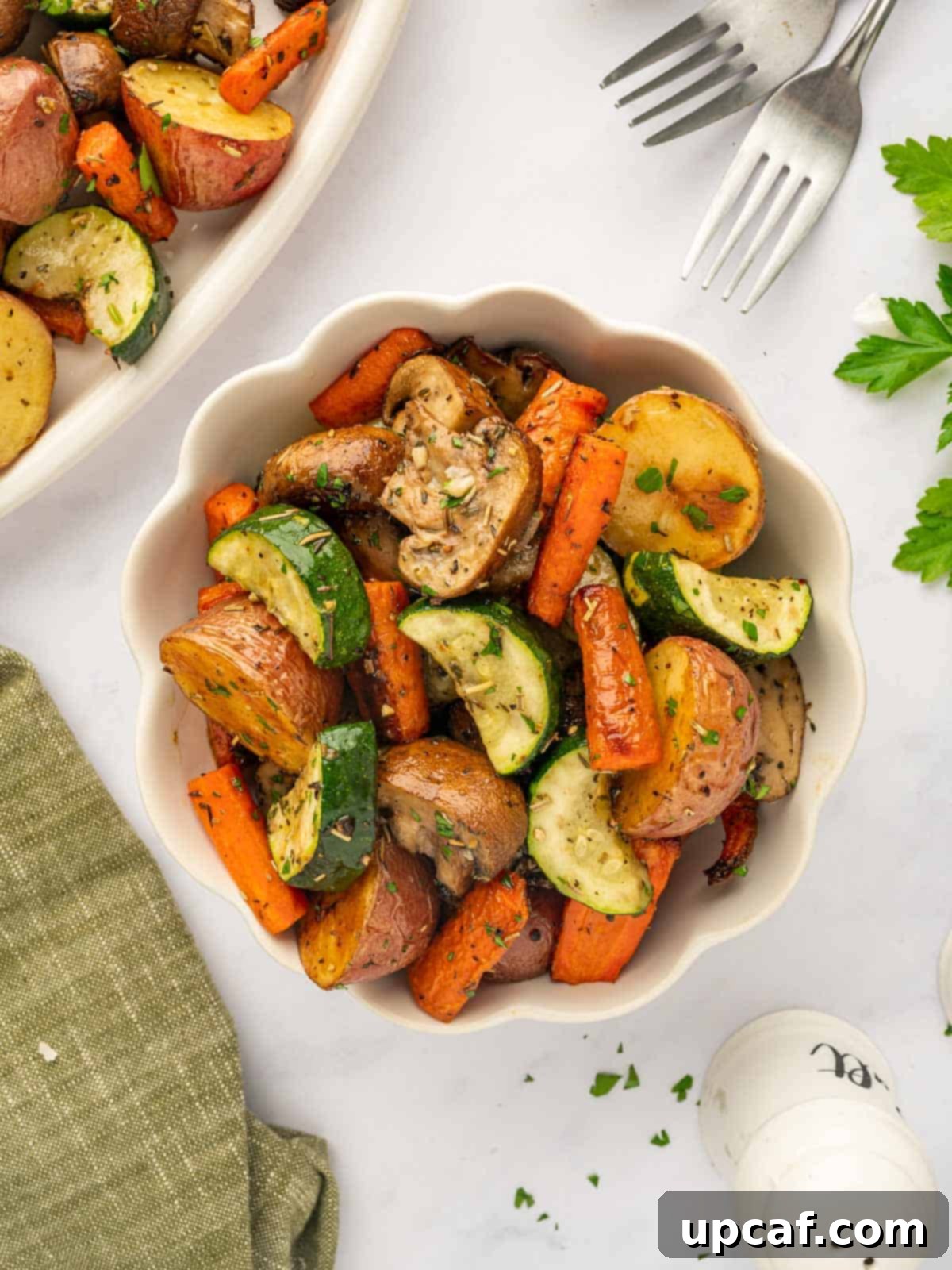 A bowl of oven roasted veggies, colorful and inviting.