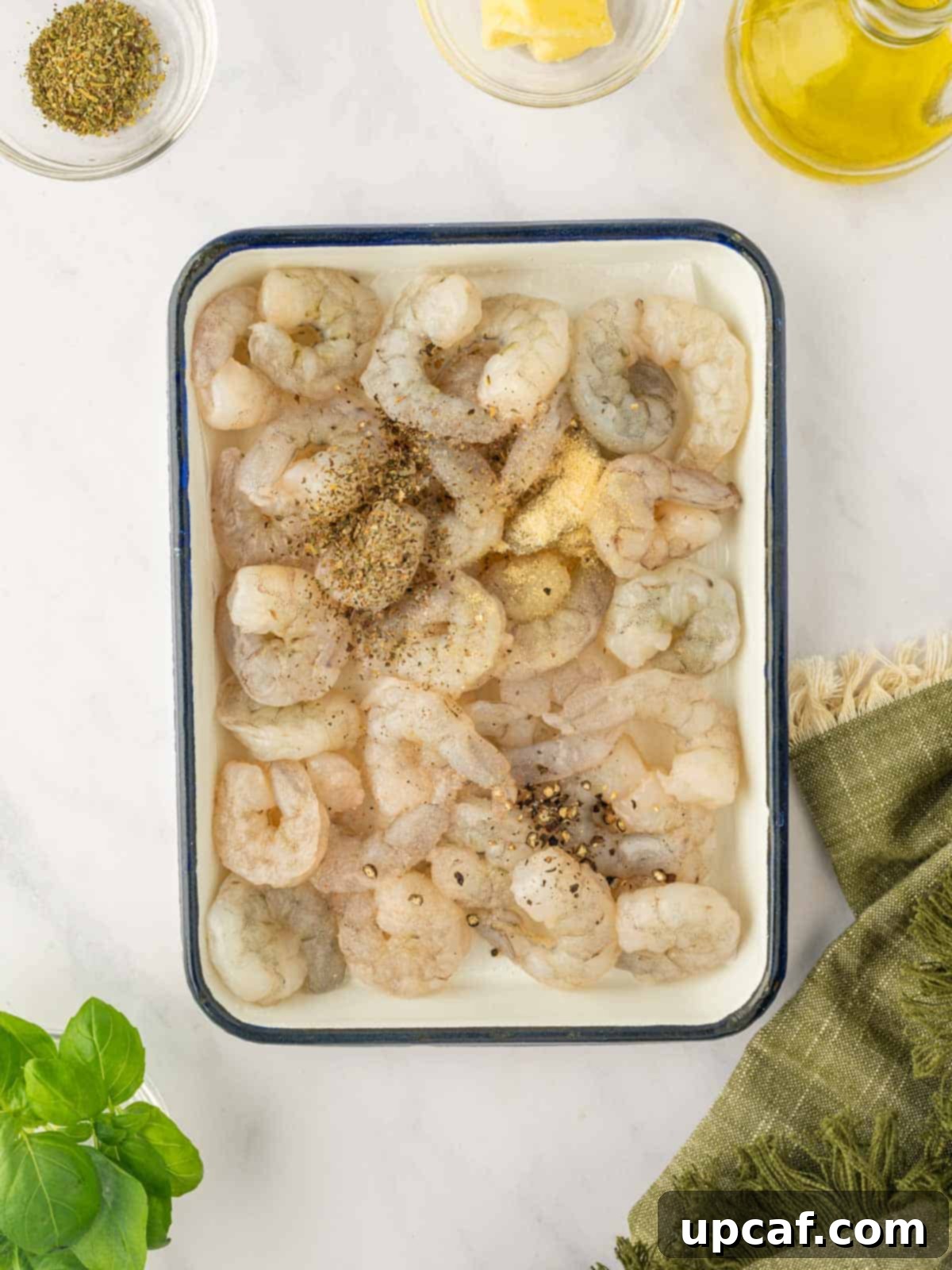 Season the raw shrimp.