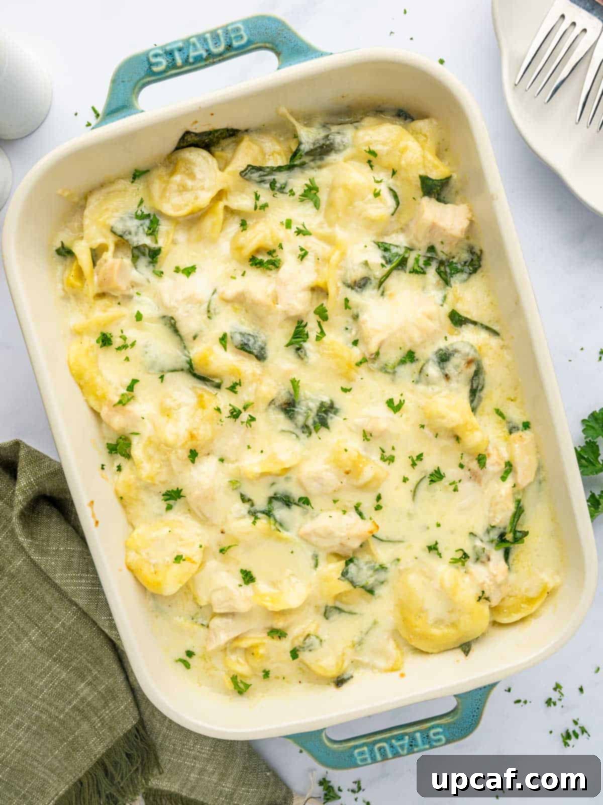 Creamy tortellini bake in a casserole dish.