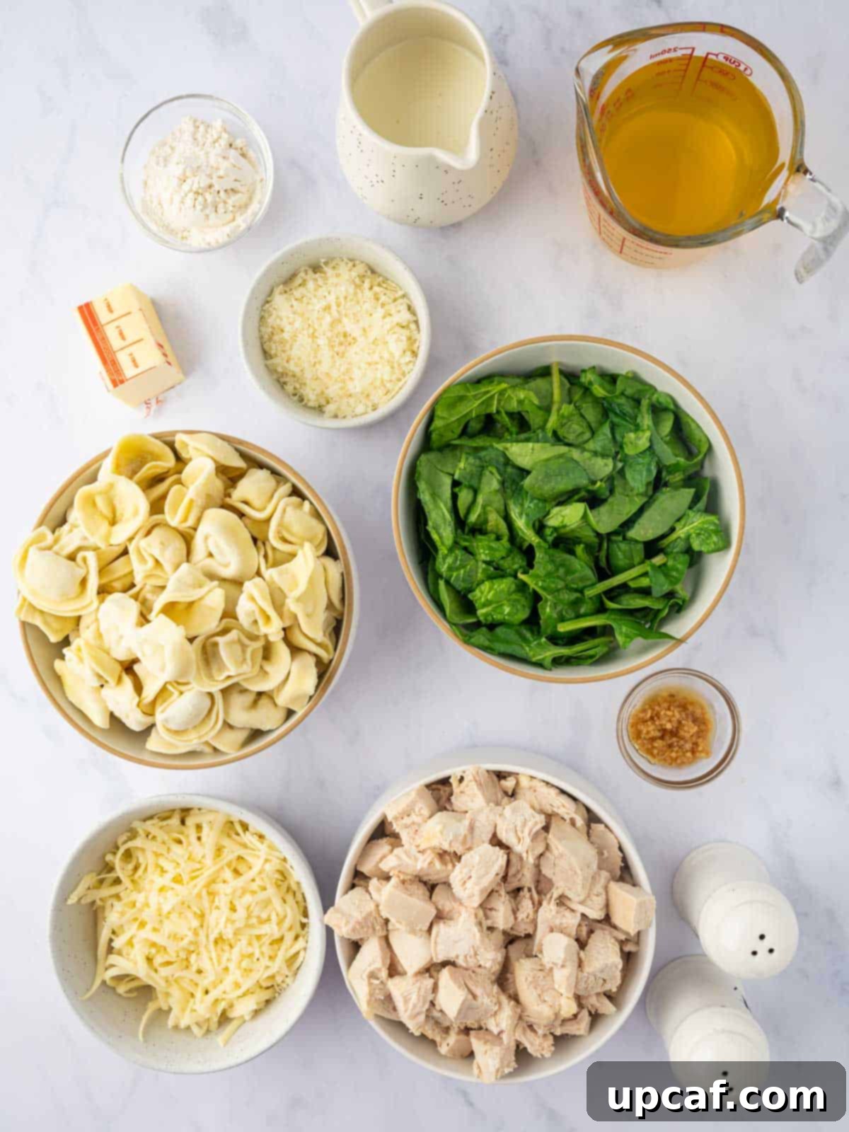 Ingredients needed for creamy tortellini bake.