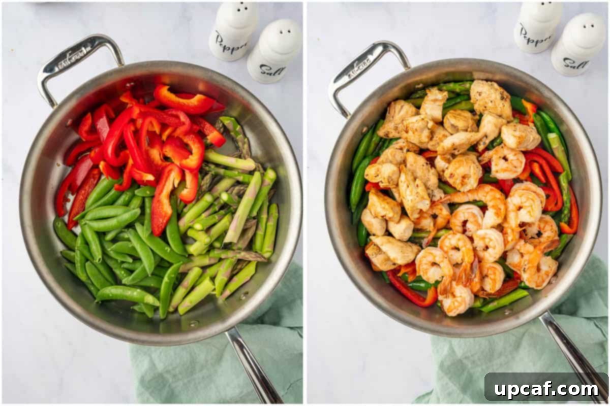 Surf and Turf Stir Fry 6 Process photo showing vegetables stir-frying in a skillet, with cooked chicken and shrimp waiting to be added back.