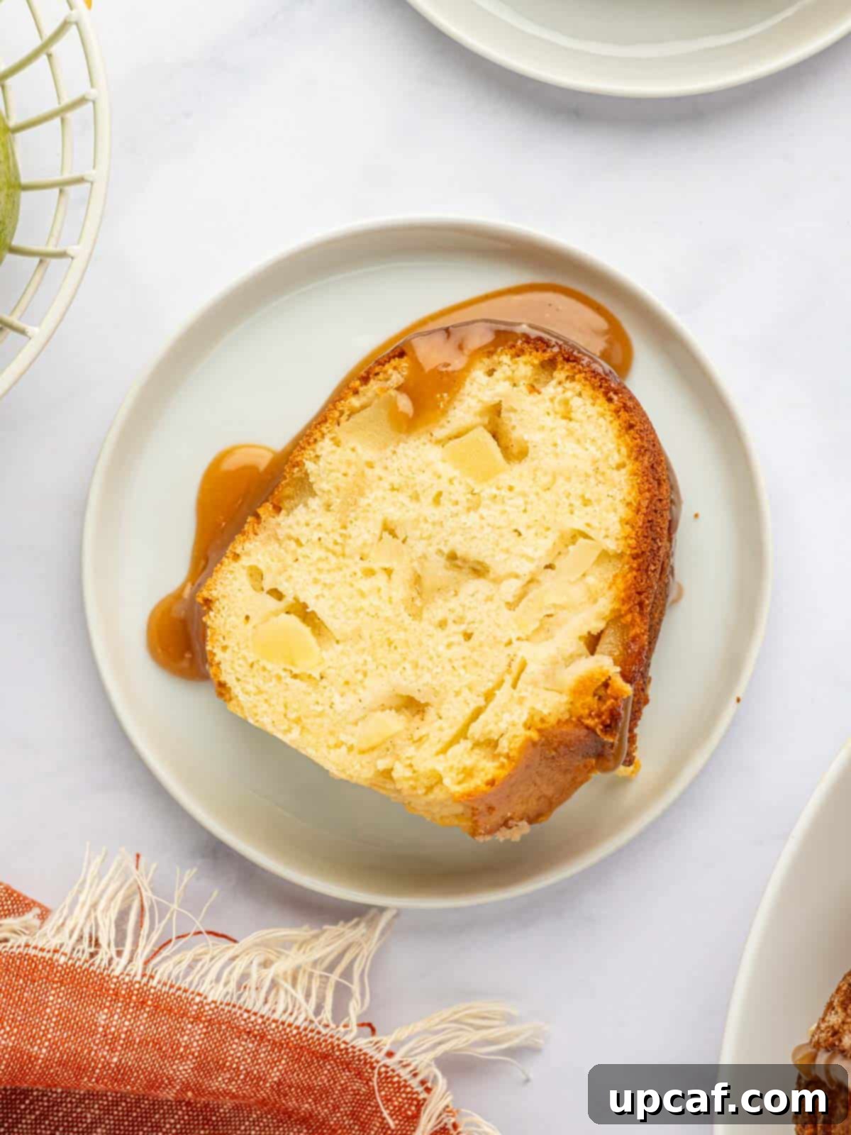 A slice of pear cake on a plate.