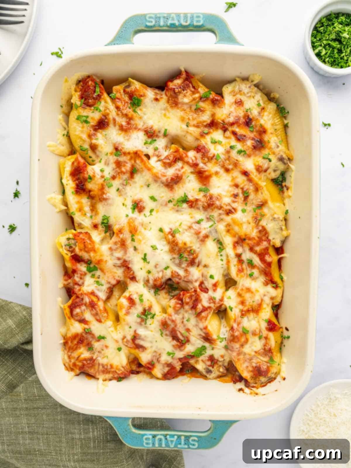 Hearty Beef and Ricotta Stuffed Shells 2 A pan of golden-brown stuffed pasta shells filled with beef and cheese, fresh from the oven.