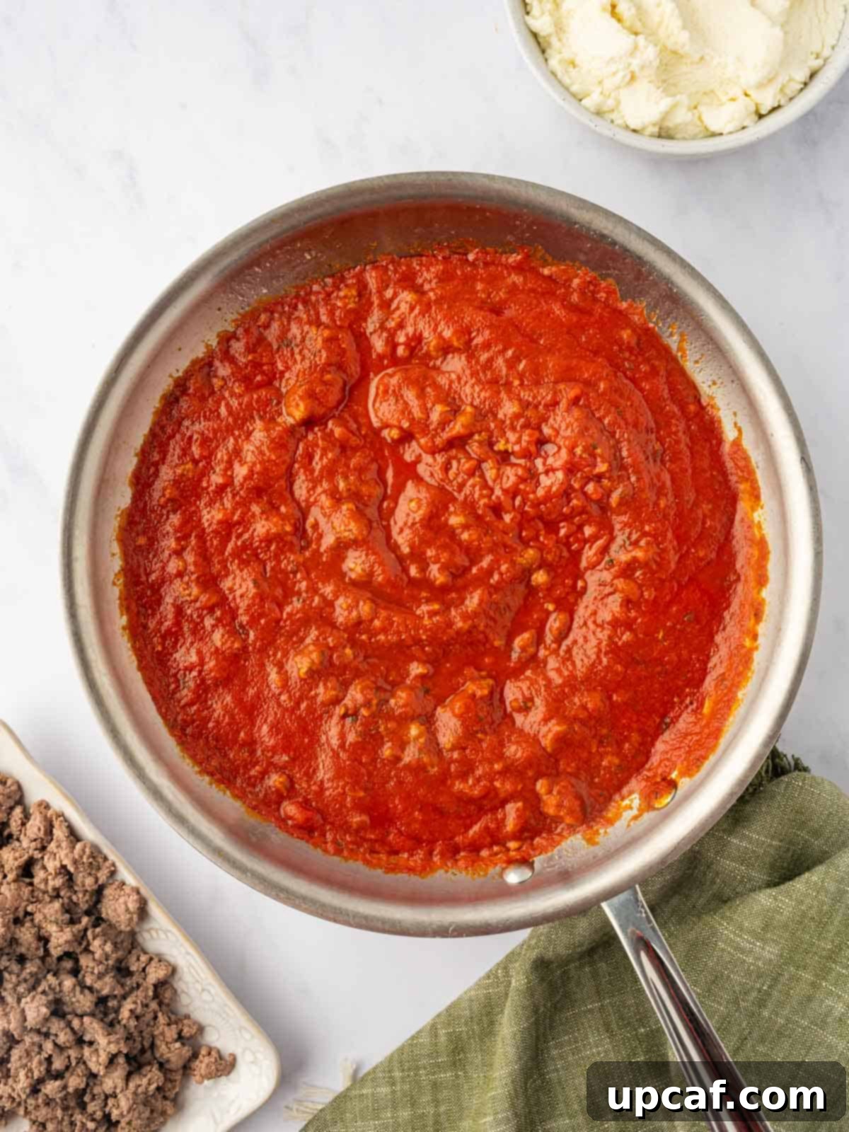 Hearty Beef and Ricotta Stuffed Shells 5 A jar of rich marinara sauce, ready to be added to the browned ground beef.