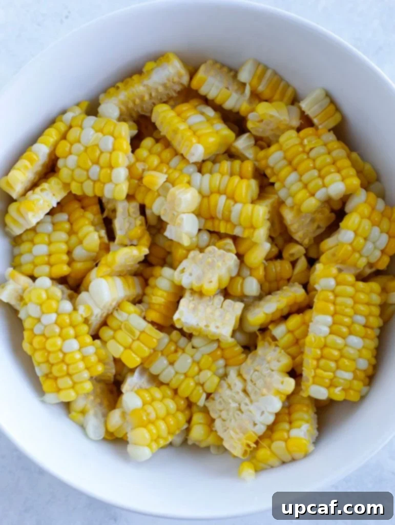 Freshly cut corn kernels in a bowl