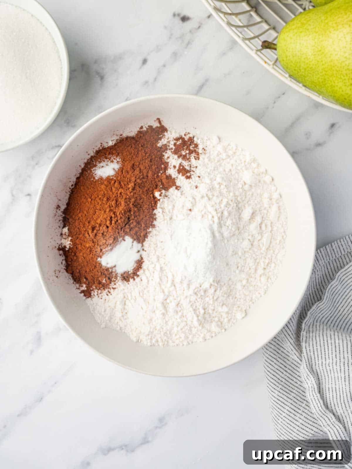Chocolate Pear Bliss 4 Bowl containing dry ingredients for chocolate pear cake.