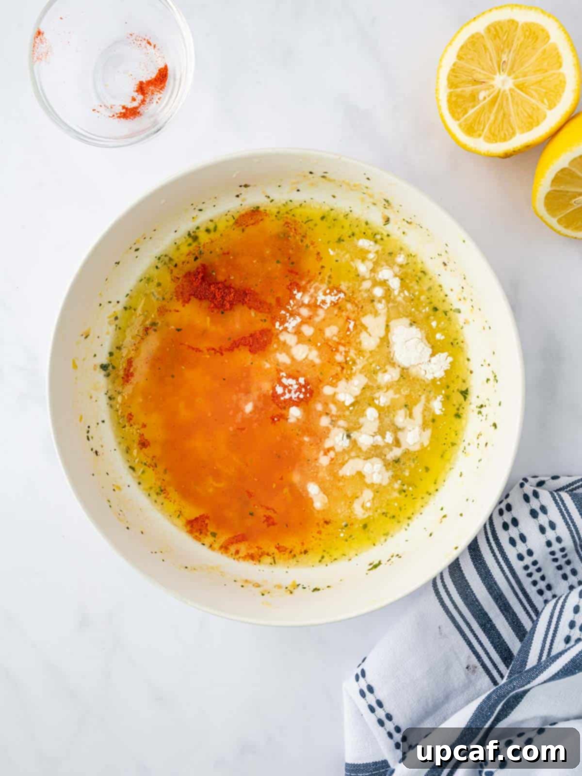 Preparing the lemon pepper marinade for chicken.