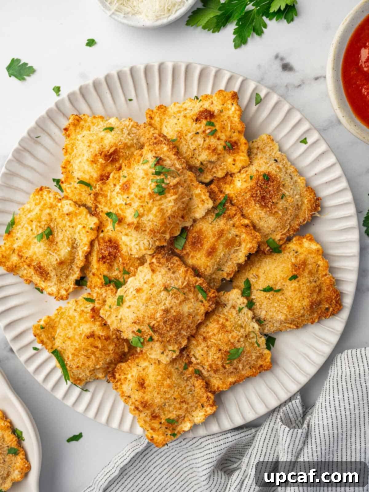 Air fryer ravioli on a plate.