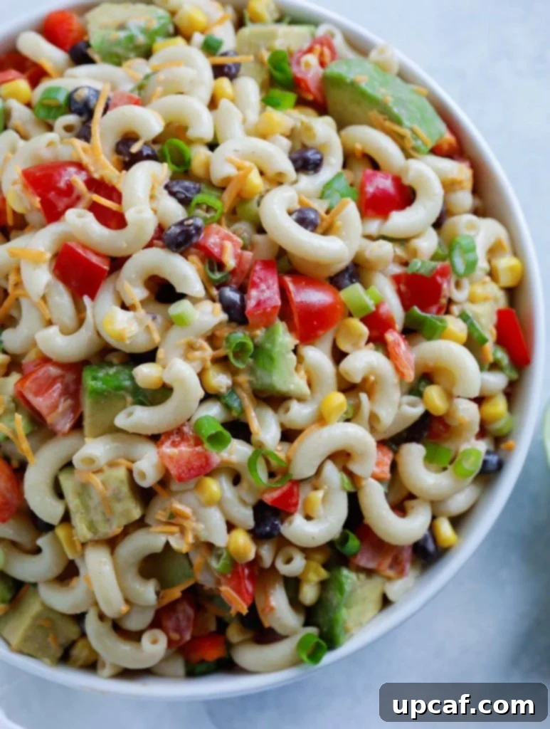 Taco Ranch Pasta Salad served in a white bowl, garnished with fresh cilantro, ready to be enjoyed.