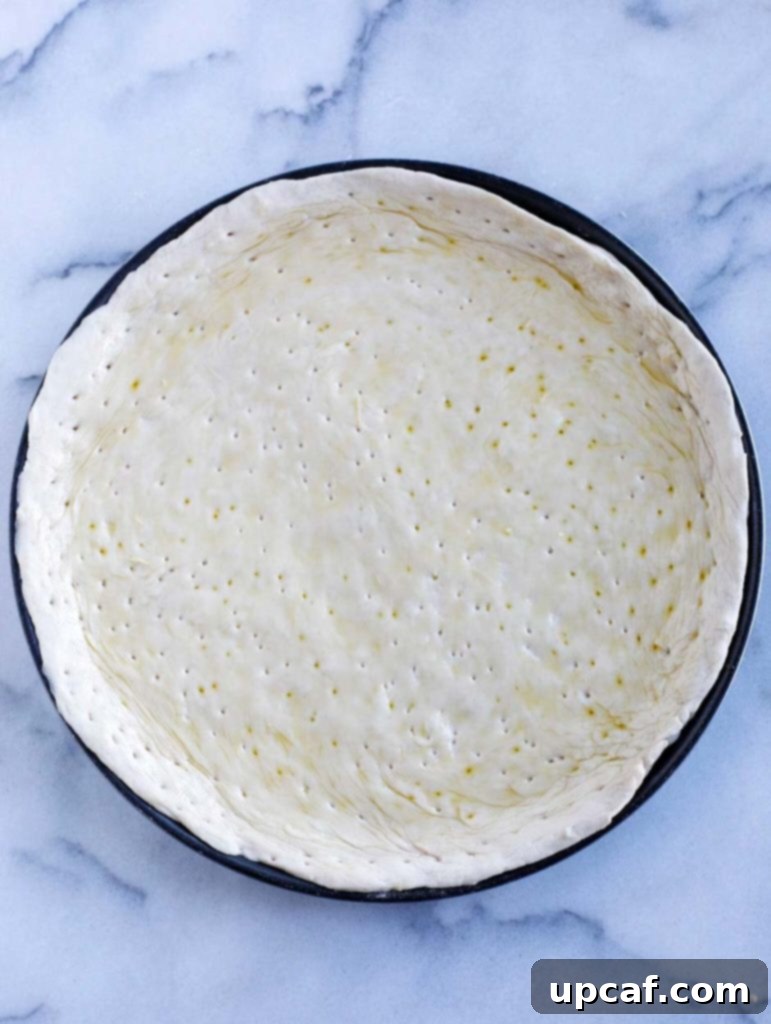 Mediterranean Harvest Pizza 2 Mediterranean Veggie Pizza base with olive oil brushed on it