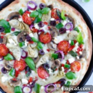 Mediterranean Harvest Pizza 5 Mediterranean Veggie Pizza with delicious pesto sauce, topped with some alfredo sauce, and packed with fresh veggies and cheese.