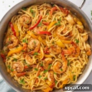 One Love Shrimp Pasta 12 Jamaican Shrimp Rasta Pasta in a skillet, ready to be served.