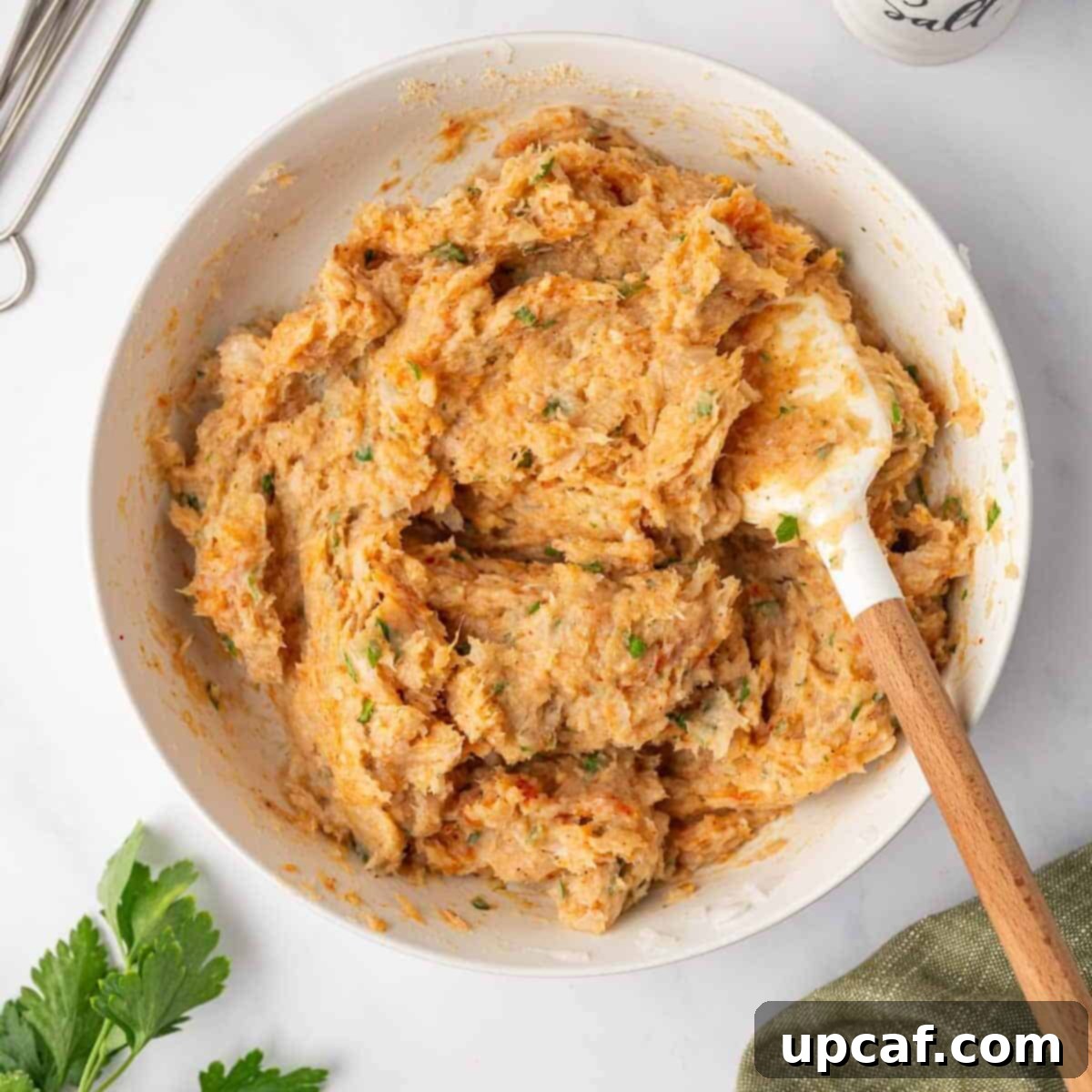 Perfectly Spiced Chicken Kofta 5 The ground chicken mixture is thoroughly stirred by hand until all ingredients are uniformly combined and the mixture is cohesive.